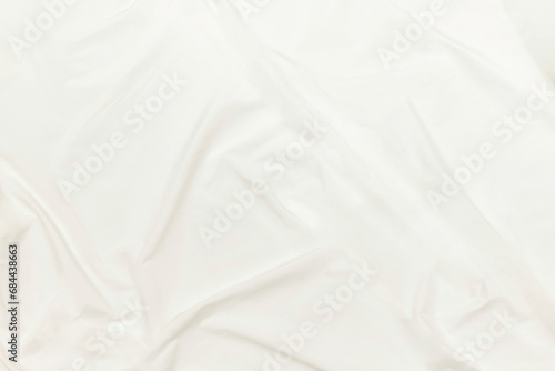 Abstract white fabric texture background Cloth soft wave. Creases of satin  silk  and cotton.