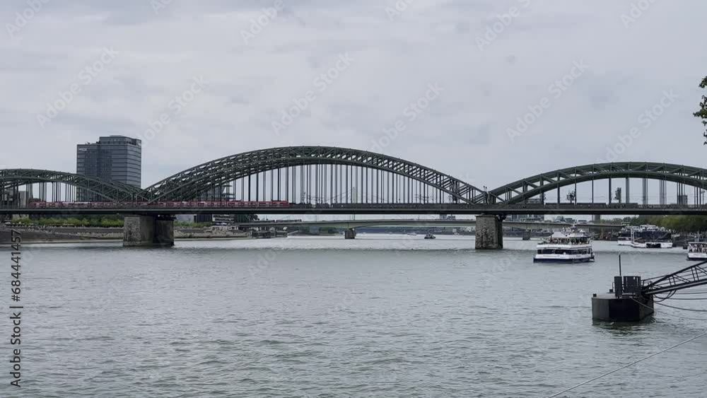 Bridge made of shalt struts and metal over which an S-Bahn runs Hohenzollern Bridge in Cologne over the Rhine Bridge made of shalt struts and metal over which an S-Bahn runs Hohenzollern Bridge in Cologne over the Rhine