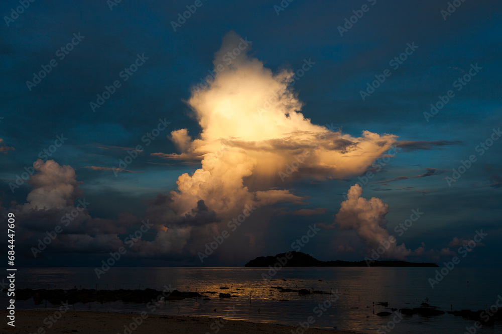 Beautiful bright cloud above the ocean at dusk. Early morning landscape at Sabah, Malaysia.
