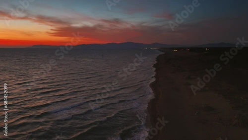Wallpaper Mural Tuscany sandy beach waves by sunset. Maremma Toscana, Italy, seaside aerial. Red cloud evening sky. Torontodigital.ca
