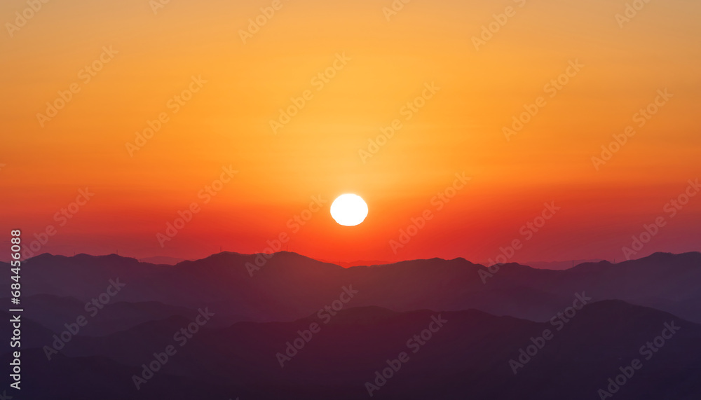 A landscape where the sun is setting. sunset, orange glow