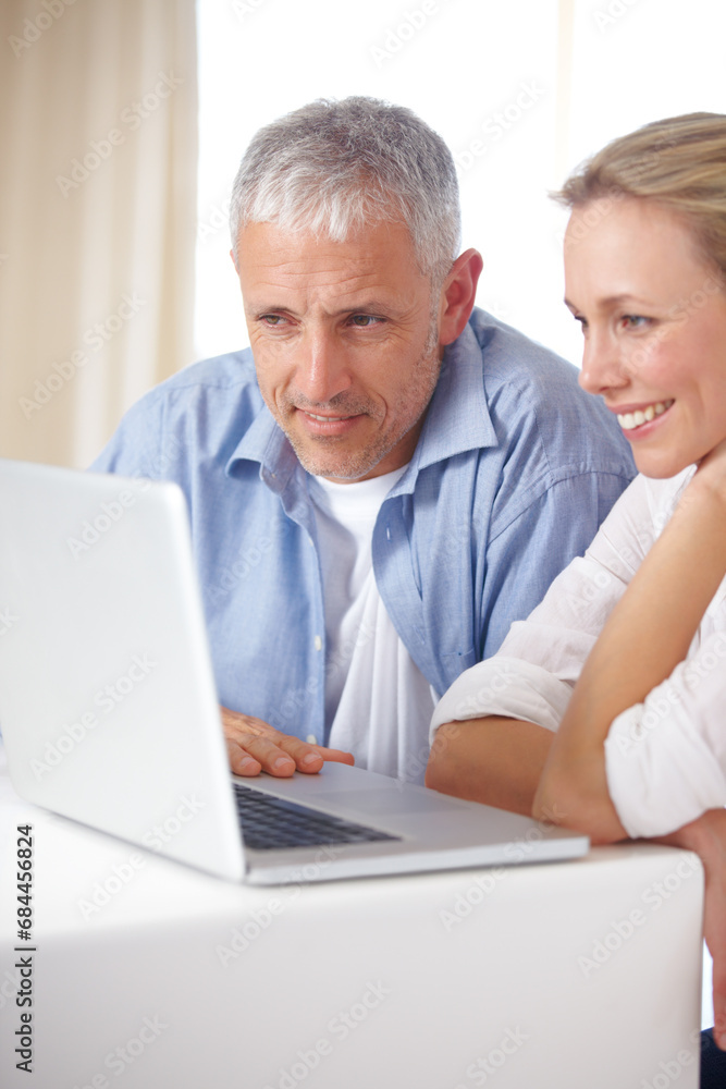 Married couple, laptop and video call with smile, conversation and living room couch. Social media, technology and communication at home, husband and wife with connection, streaming and happy Married couple, laptop and video call with smile, conversation and living room couch. Social media, technology and communication at home, husband and wife with connection, streaming and happy
