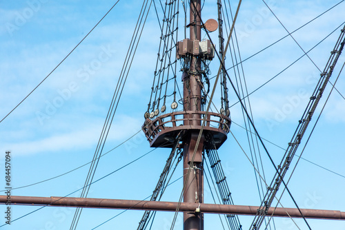 Mast on a ship against the blue sky
