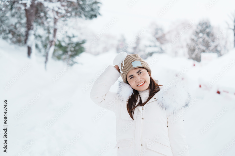happy Traveler with Sweater and backpack walking on snow covered forest in frosty weather. Winter Travel, Adventure, Exploring and Vacation concept happy Traveler with Sweater and backpack walking on snow covered forest in frosty weather. Winter Travel, Adventure, Exploring and Vacation concept