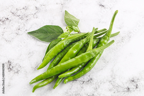 Spicy green chili pepper heap