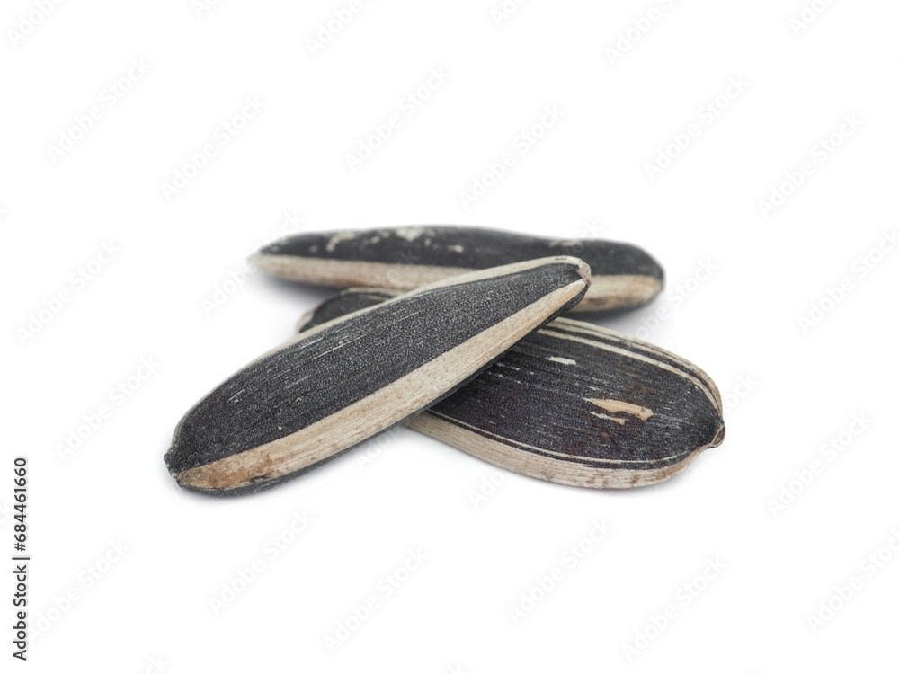 Dried sunflower seeds are ready to eat. Placed isolated on a white background. Dried sunflower seeds are ready to eat. Placed isolated on a white background.