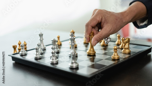 A smart businessman plays a game of chess with the opposing team. Plan business strategies to develop for victory and success. Difficulty and goal attainment Business strategy for victory
