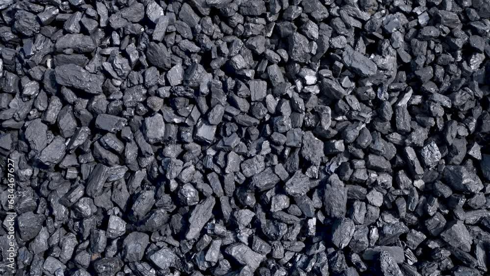 Black natural coal. Charcoal background. Energy industry. Solid fuel. Panoramic movement from bottom to top. Conveyor. Black natural coal. Charcoal background. Energy industry. Solid fuel. Panoramic movement from bottom to top. Conveyor.