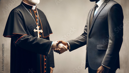 Church and State concept.A politician and priest shake hands. photo