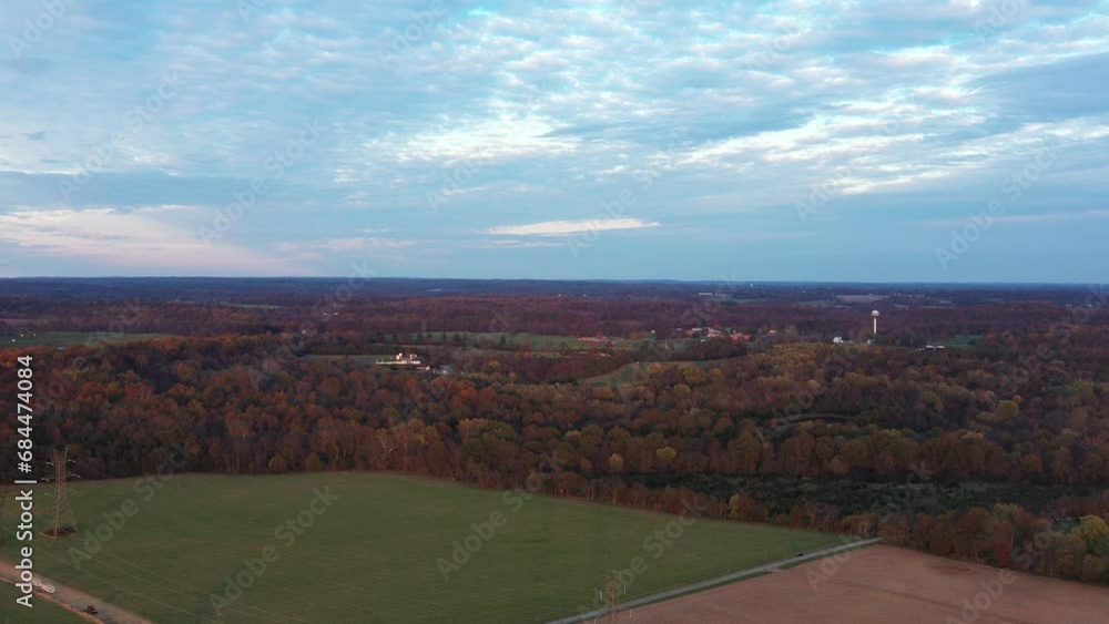 An aerial shot of Poolesville, nestled in Montgomery County, Maryland during autumn, at sunset. The rural landscape offers a serene escape just an hour's drive from Washington DC. An aerial shot of Poolesville, nestled in Montgomery County, Maryland during autumn, at sunset. The rural landscape offers a serene escape just an hour's drive from Washington DC.