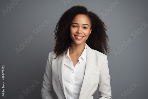 Portrait of young African American woman wearing a suit smiling