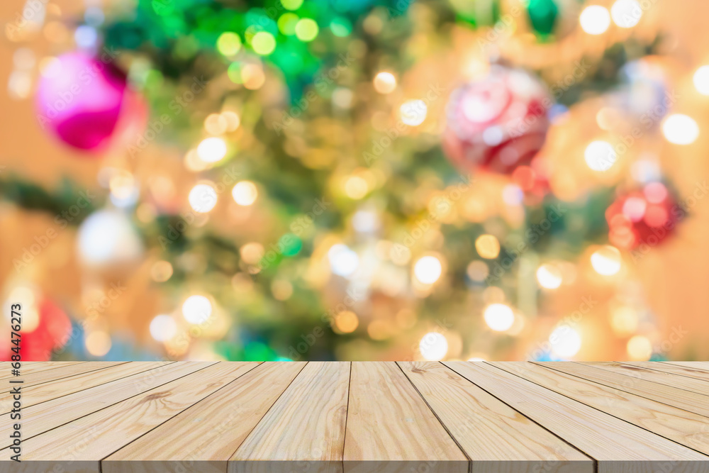 Empty wood table top with blur Christmas tree with bokeh light background Empty wood table top with blur Christmas tree with bokeh light background
