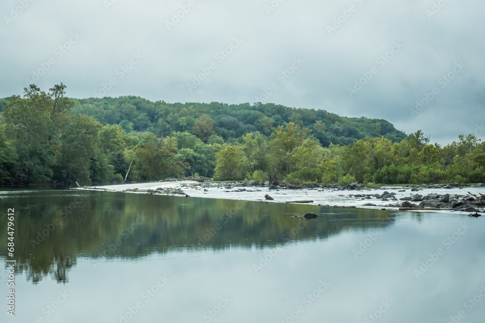 Calm water of Potomac River near Washington, D.C., on a cloudy day. Calm water of Potomac River near Washington, D.C., on a cloudy day.