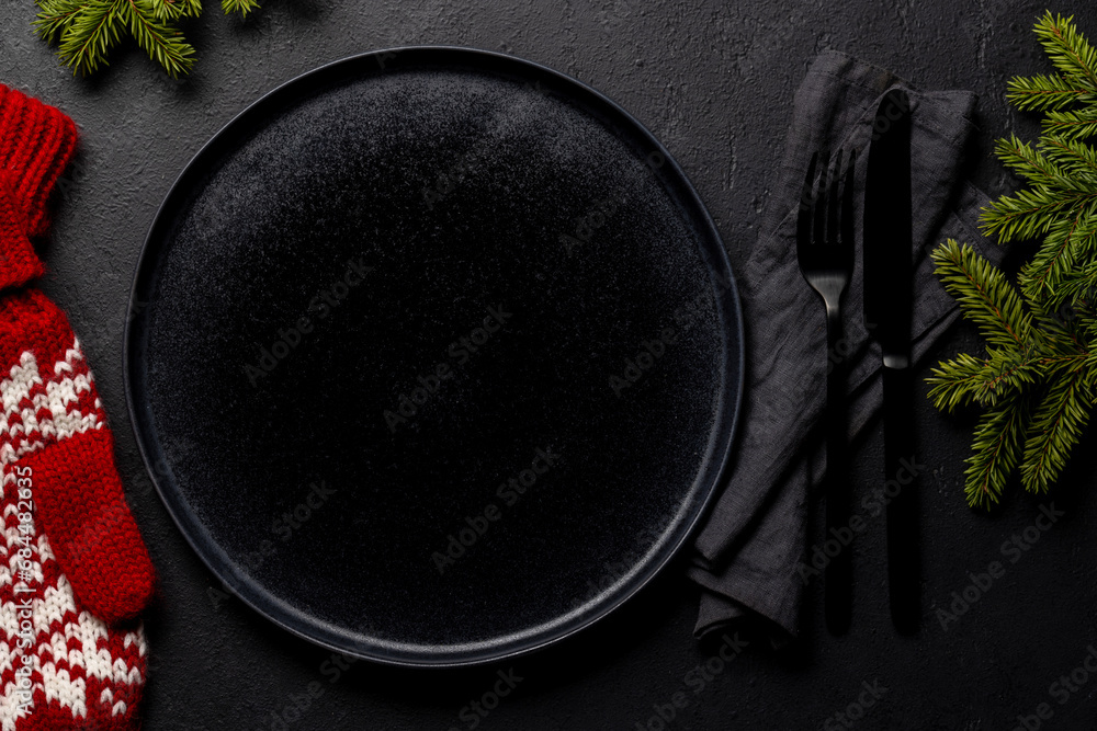 Mockup for a festive Christmas meal: Empty plate with festive fir tree branches Mockup for a festive Christmas meal: Empty plate with festive fir tree branches