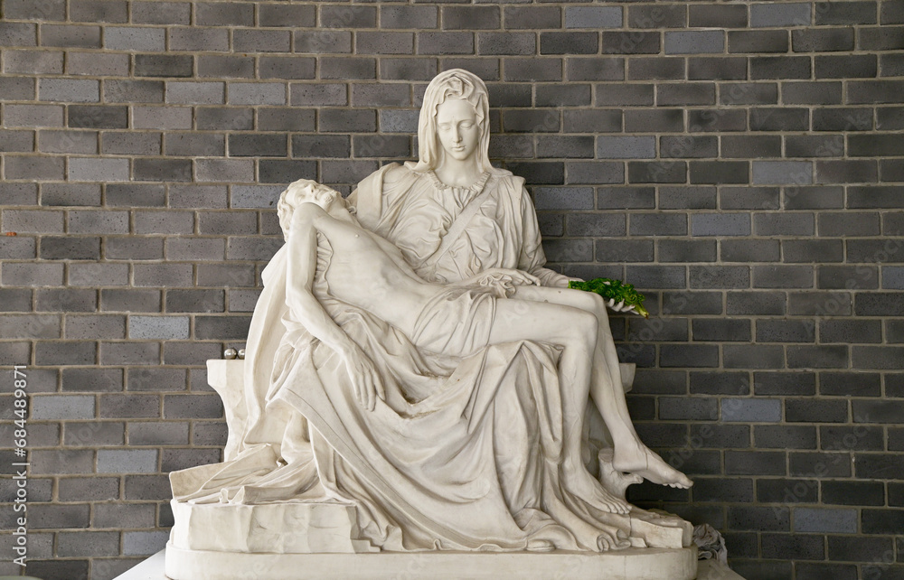 Closeup of Statue of Our lady and Jesus in catholic church, Thailand. selective focus Closeup of Statue of Our lady and Jesus in catholic church, Thailand. selective focus