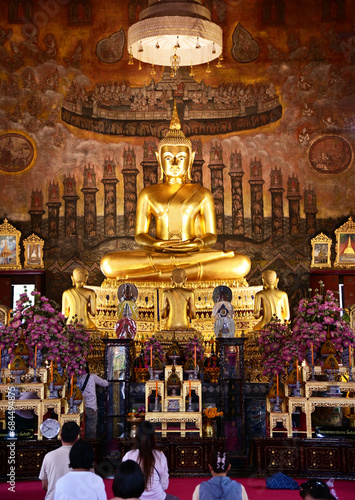 BANGKOK, THAILAND - November 28, 2023: Golden Buddha statue in meditation posture located inside the temple for those who have faith to come to pay respect and worship in temples in Thailand.