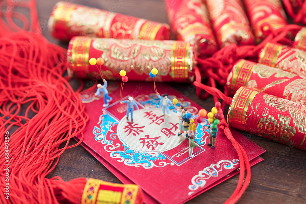 Miniature creative and happy children celebrate the New Year.The Chinese characters in the picture mean: 