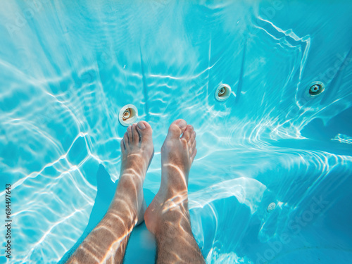 Hot tub, underwater shot of male legs in water © Bits and Splits