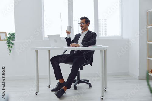 Desk man sitting working unhappy problem business worried office laptop thinking tired glasses