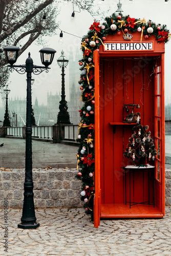 Red telephone booth decorated for Christmas