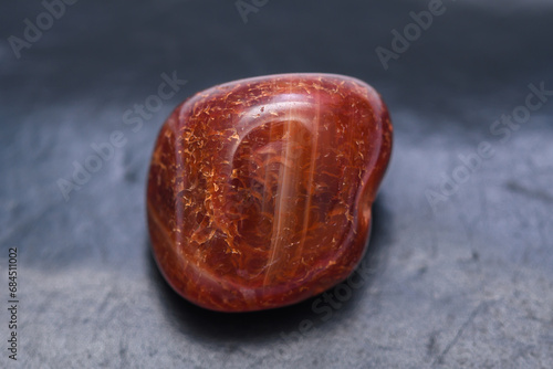 Minerał jaspis czerwony kamień szlachetny z bliska na czarnym tle photo