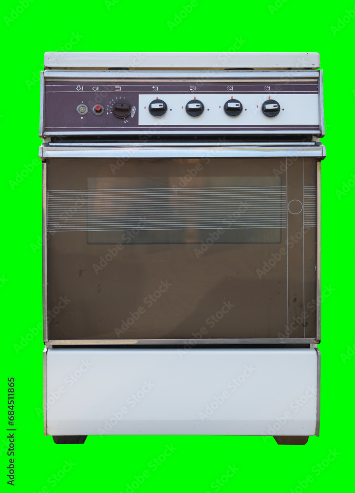 Obraz premium Old gas stove isolated on green background. Recycling of household appliances.