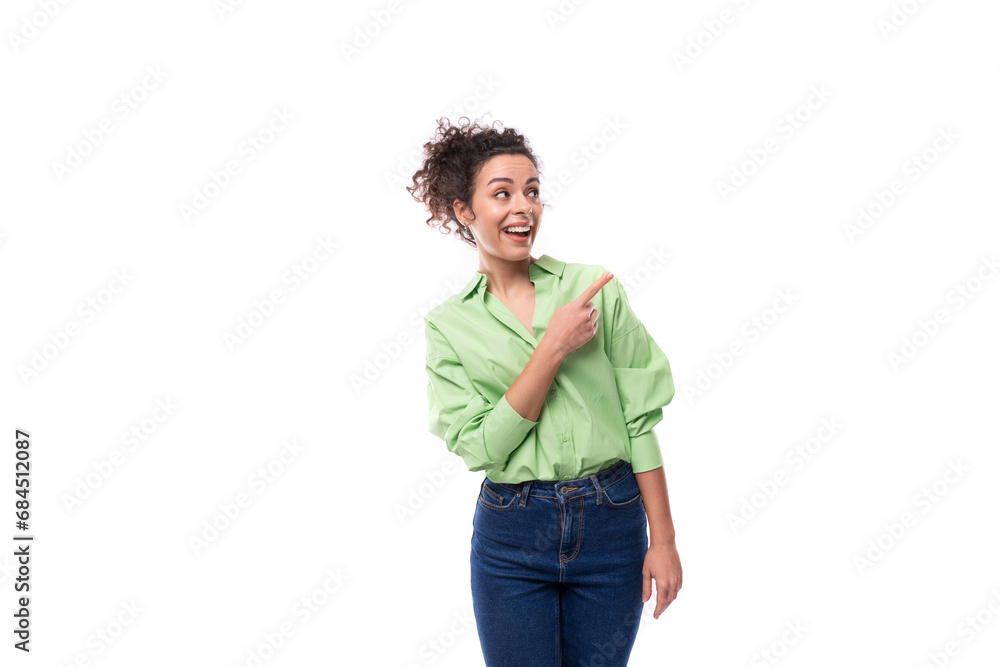 portrait of a young charming brunette businesswoman with curly hair gathered in a bun dressed in an office light green shirt on a white background with copy space portrait of a young charming brunette businesswoman with curly hair gathered in a bun dressed in an office light green shirt on a white background with copy space