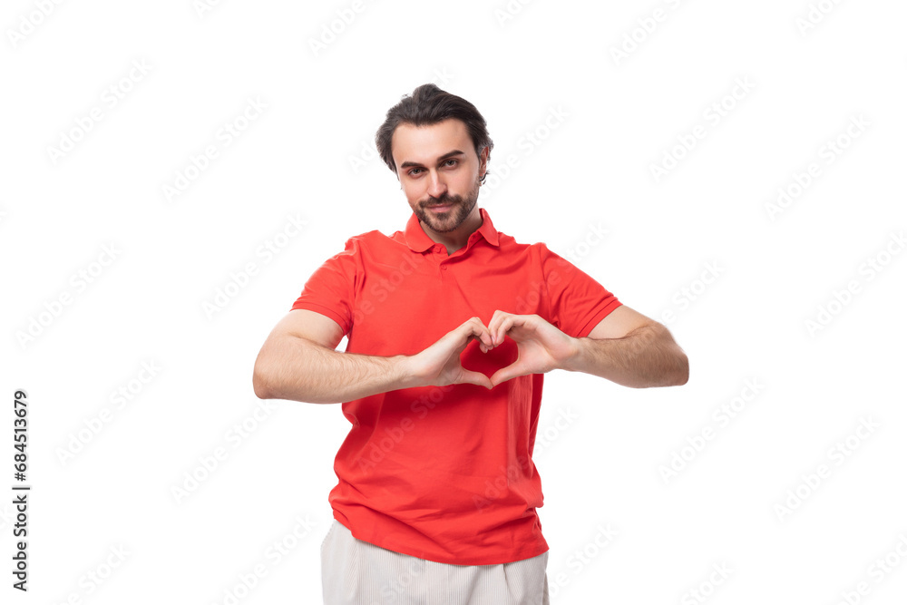 young handsome man with black hair and beard dressed in a red t-shirt uniform young handsome man with black hair and beard dressed in a red t-shirt uniform
