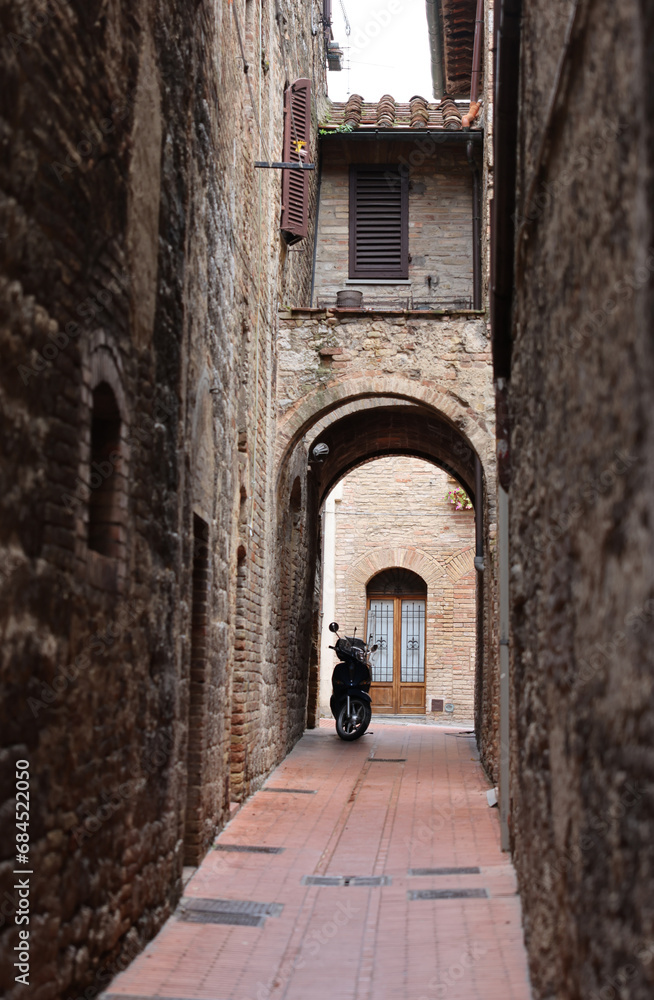 The medieval atmosphere of the streets in San Gimignano. Tuscany, Italy