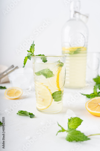 Lemonade with mint on a white background. Cool drink with lemon and mint.