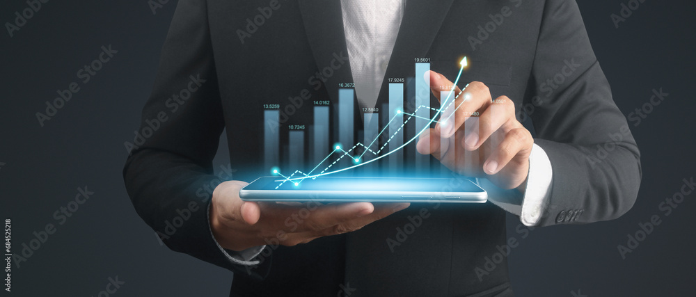 Businessman plan graph growth and increase of chart positive indicators,tablet in hand Businessman plan graph growth and increase of chart positive indicators,tablet in hand