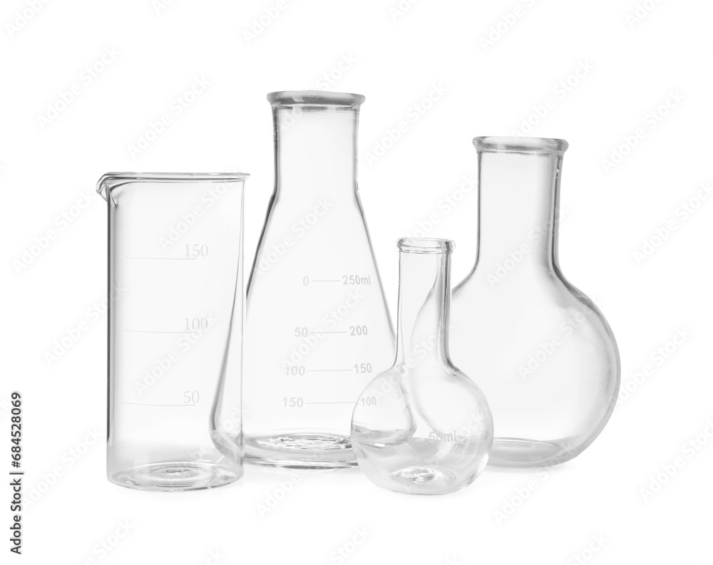 Many laboratory flasks and beaker isolated on white Many laboratory flasks and beaker isolated on white