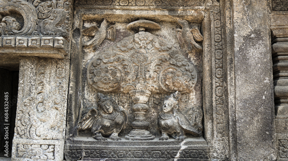 Stone relief on the wall of Prambanan Temple. A Hindu temple located in Yogyakarta, Indonesia