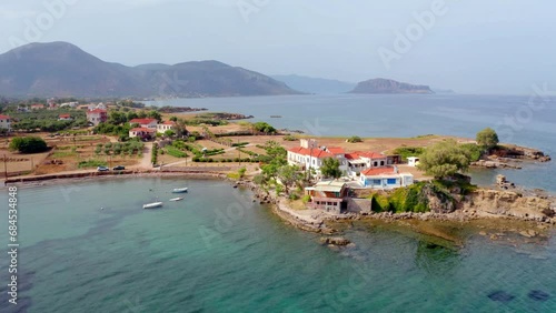 4k drone forward video (Ultra High Definition) of Xifias village vith Monemvasia mountain on background. Beautiful summer scene of Peloponnese peninsula, Greece, Europe. Bright Myrtoan Sea. photo