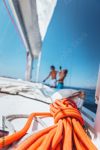 Two guys working on sailboat