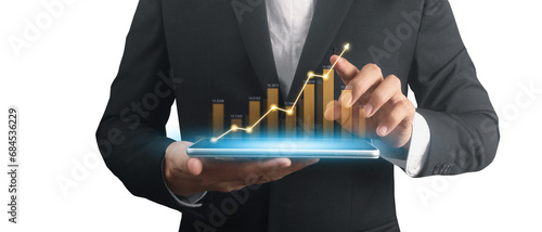 Businessman plan graph growth and increase of chart positive indicators ,tablet in hand photo