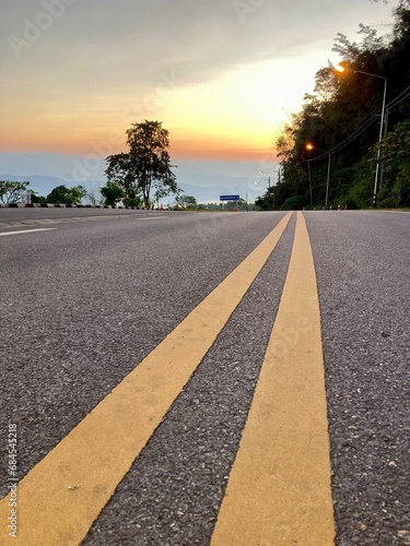 Yellow traffic line color Double solid lines to warn prohibiting overtaking, Yellow continuous tracks of prohibited overtaking painted on the asphalt, Safety driving and traffic regulating rules
