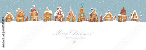 Christmas greeting card with cute gingerbread houses on mint color background with snowflakes. Vector illustration with christmas village and snowfall