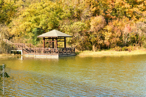 Photo of traditional Chinese style buildings by the lake