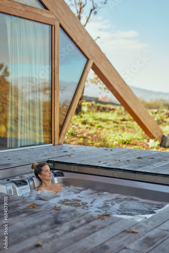 Serenity at a geometric cabin with an integrated outdoor hot tub