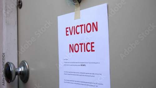Eviction Notice Being Put onto door photo