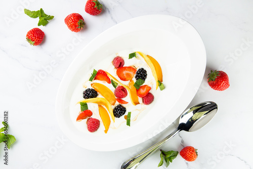 fruit salad with wild berries and strawberries side view