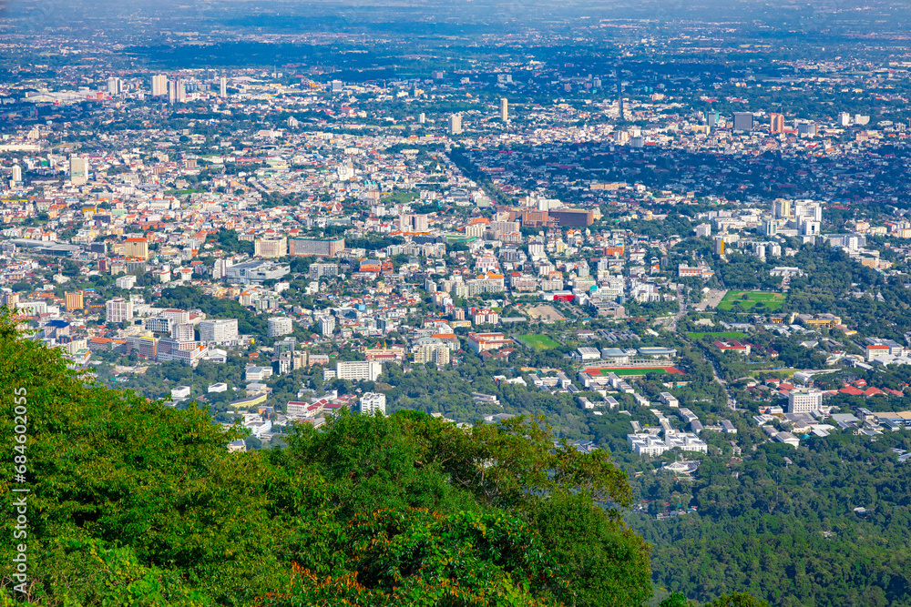 Panorama view of Chiangmai Chiang Mai city taken from Doi Suthep Mountains. Lovely views of the Old city at Sunset Sunrise lovely tropical mountains and beautiful nature in the foreground