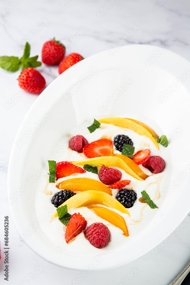 fruit salad with wild berries and strawberries side view fruit salad with wild berries and strawberries side view