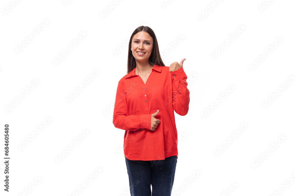 portrait of a young european brunette office worker woman dressed in a red loose shirt on a white background portrait of a young european brunette office worker woman dressed in a red loose shirt on a white background
