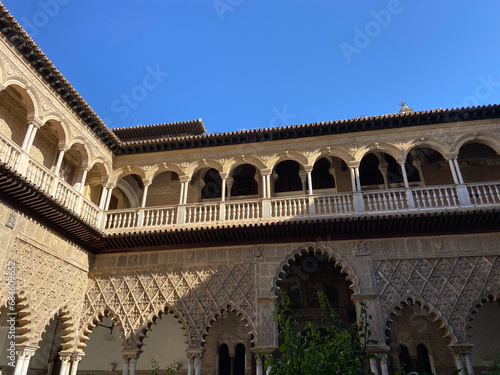 Seville, Spain, September 12, 2021: Royal Palace of Seville (Real Alcazar). The Maidens Courtyard. The Mudejar of Pedro I on the ground floor and the Renaissance of the first monarchs.