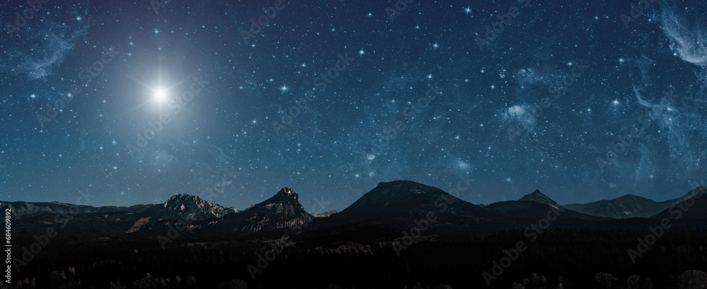 Christmas star shines at night over the mountains of Bethlehem Christmas star shines at night over the mountains of Bethlehem