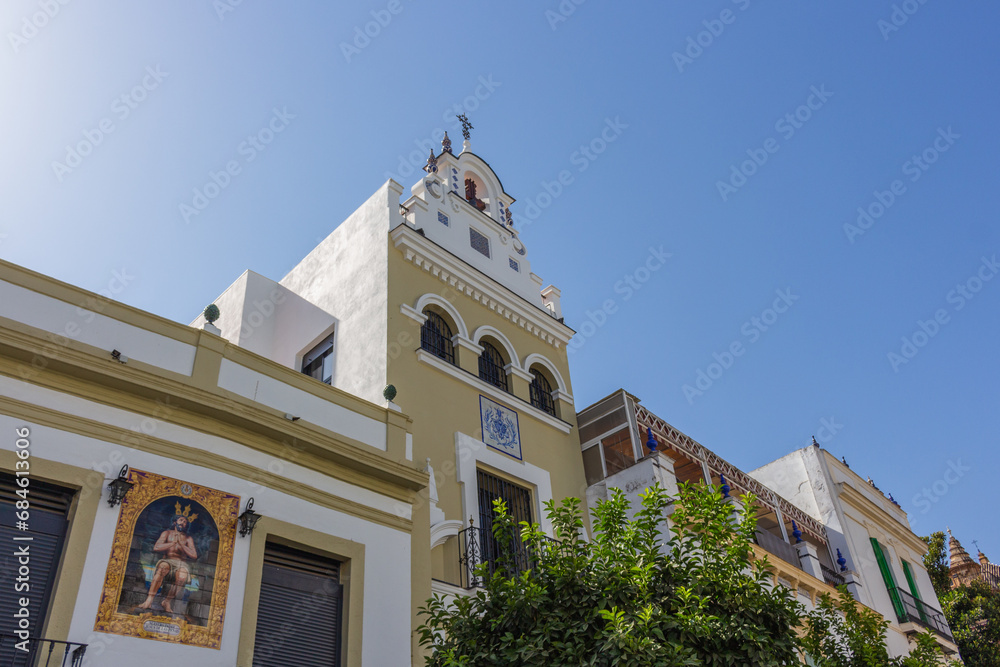 Seville, Spain, September 12, 2021: Situated on the left banks of the Guadalquivir River, Triana is one of the most essential, charismatic, and colorful neighborhoods of the Andalusian city.
