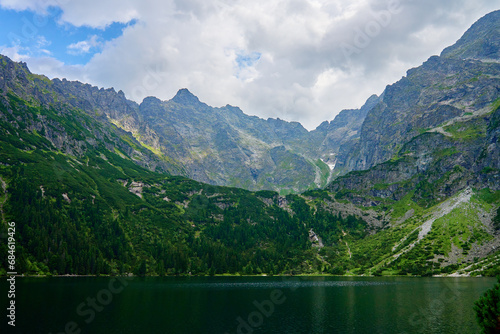 Amazing view on mountains range near beautiful lake at summer day. Tatra National Park in Poland. Panoramic view on Morskie Oko or Sea Eye lake in Five lakes valley © Lazy_Bear