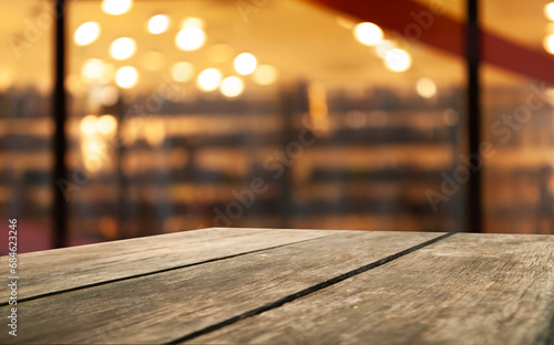 Wallpaper Mural wooden table and bokeh cafe background. product display template Torontodigital.ca